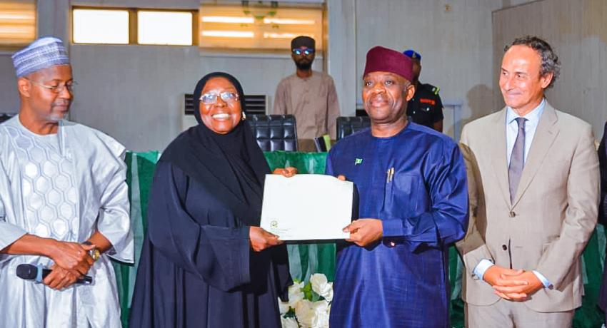 Prof Amina Mustapha,  the DVC R&D receiving the award letter